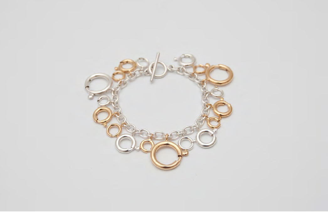Sonja Bischur, Spring/Summer 2011, silver charm bracelet with silver and gold plated spring ring clasps